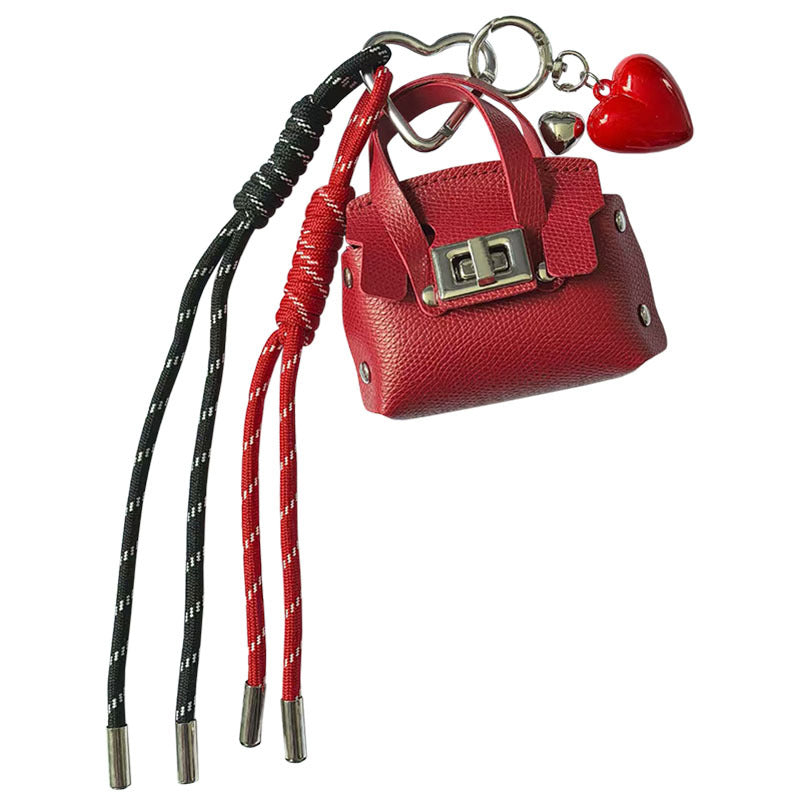 Creative miu is a personalized mini leather pouch keychain, headphone bag, accessories, keychain, school bag, pendant