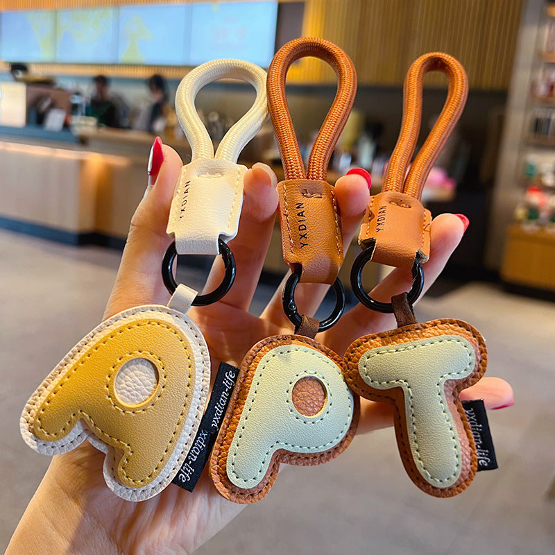 Creative PU leather 26 English letter keychain pendant simple couple car bag keychain pendant gift