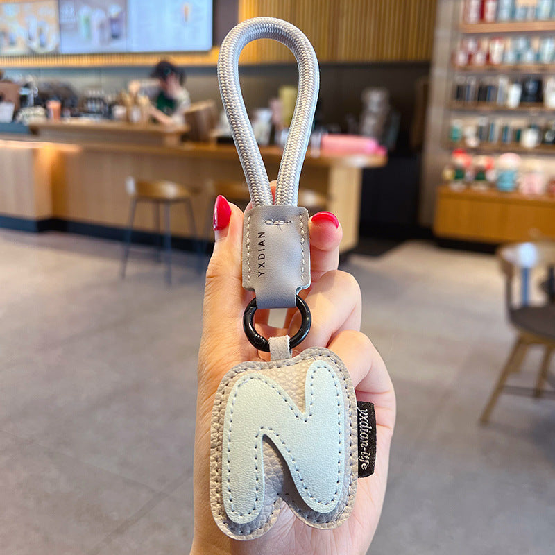 Creative PU leather 26 English letter keychain pendant simple couple car bag keychain pendant gift