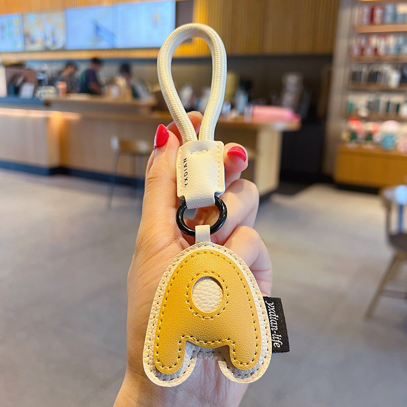 Creative PU leather 26 English letter keychain pendant simple couple car bag keychain pendant gift