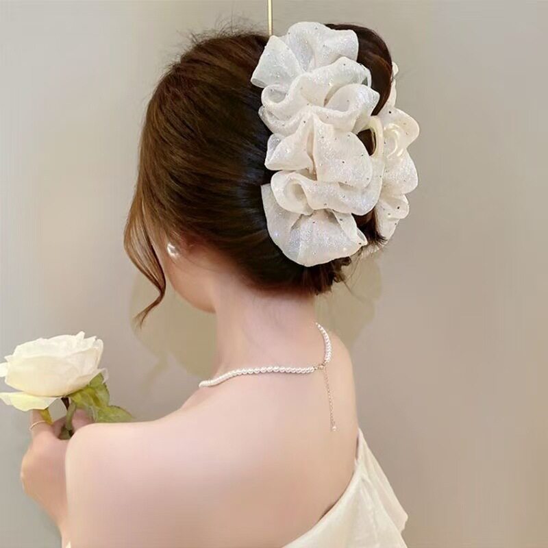 Temperament: Korean gypsophila hairpin women's high-end new feather grip clip, high-end back of the head, updo shark clip