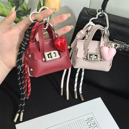 Creative miu is a personalized mini leather pouch keychain, headphone bag, accessories, keychain, school bag, pendant