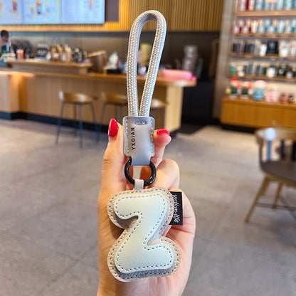 Creative PU leather 26 English letter keychain pendant simple couple car bag keychain pendant gift